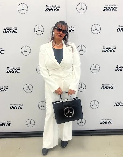 TechForce scholarship recipient Jinelee poses for a photo at the graduation ceremony for her Mercedes-Benz technician training.