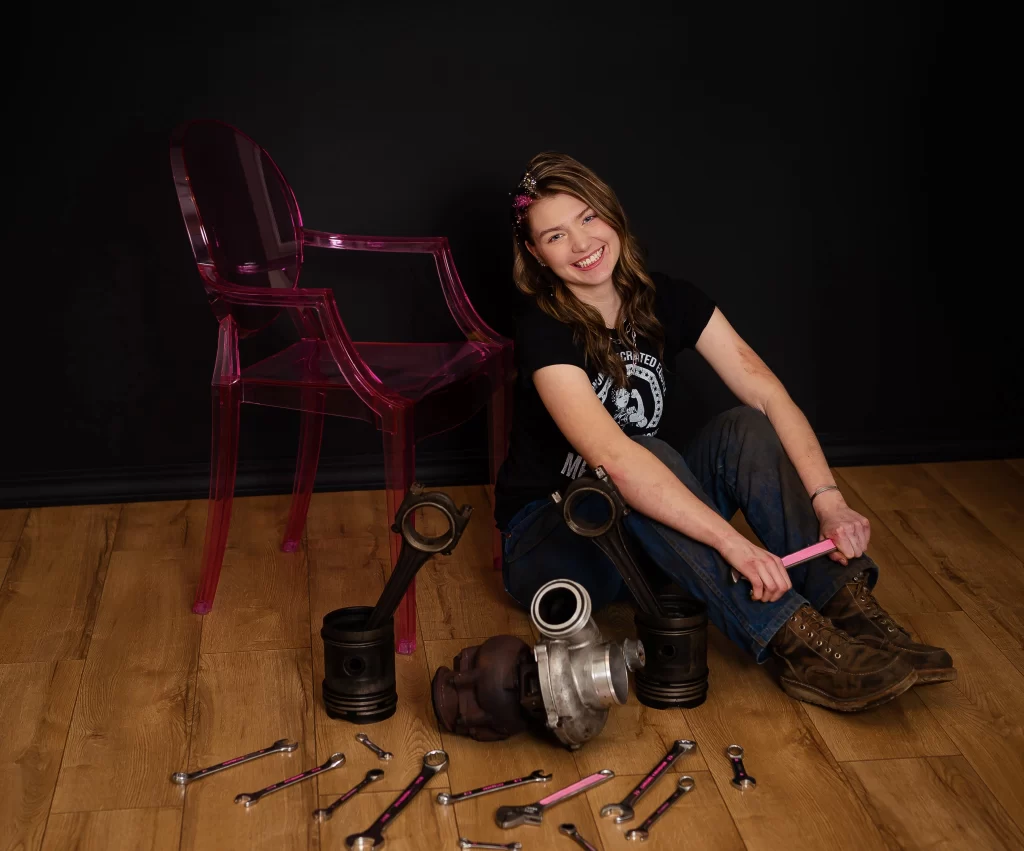 Scholarship recipient Abby Redman sits with a sampling of her tools.
